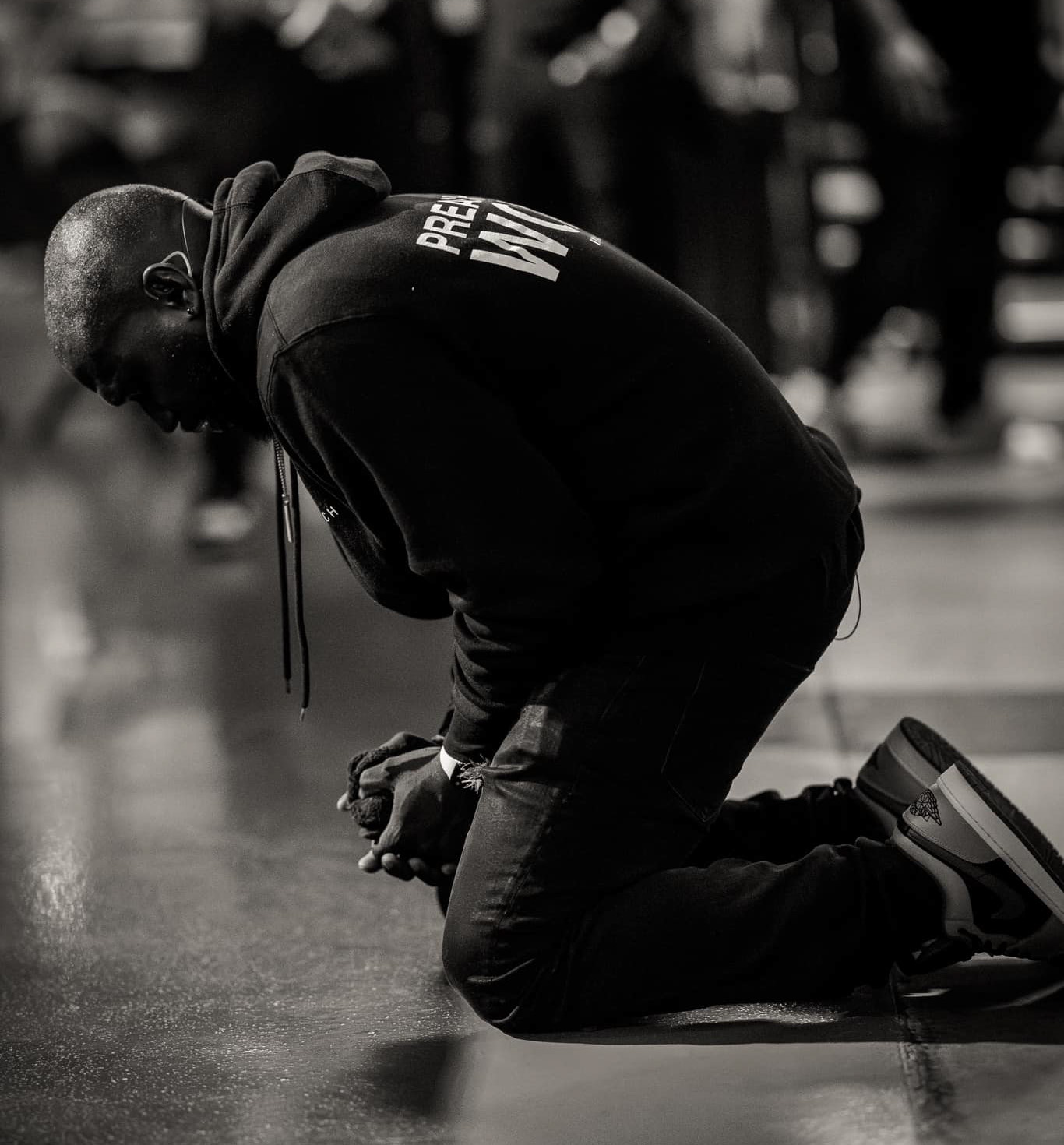 Man kneeling on stage