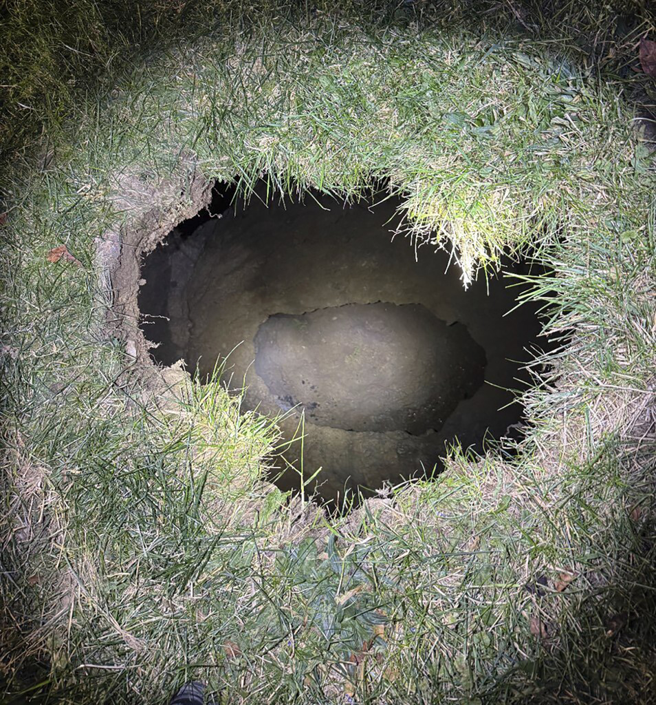 Top of a sinkhole in the village of Marguerite, Pa., where rescuers were searching for a woman who disappeared