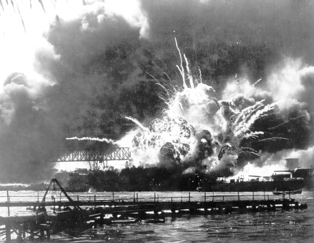 The destroyer USS Shaw explodes after being hit by bombs during the Japanese attack on Pearl Harbor