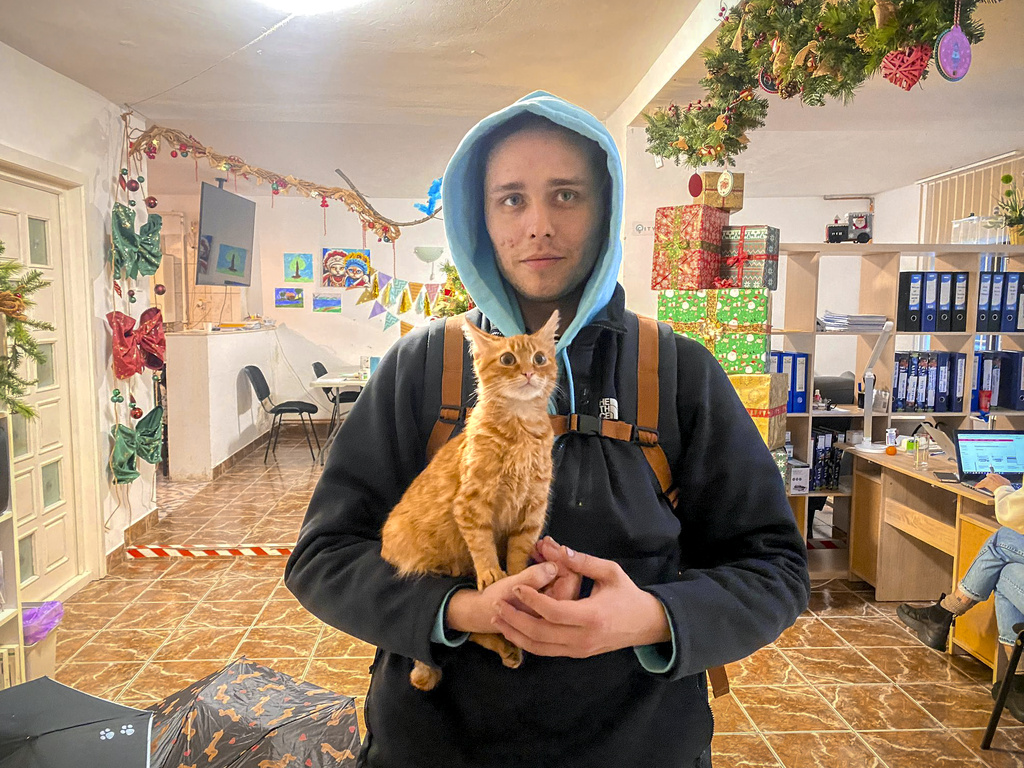 Vladislav Duda with his cat Peach 