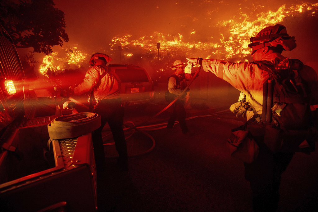 Firefighters battle the Franklin Fire in Malibu, Calif.