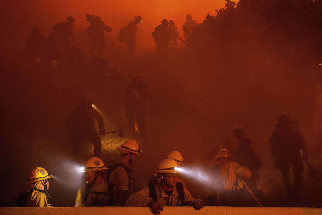 Firefighters battle the Franklin Fire in Malibu, Calif.