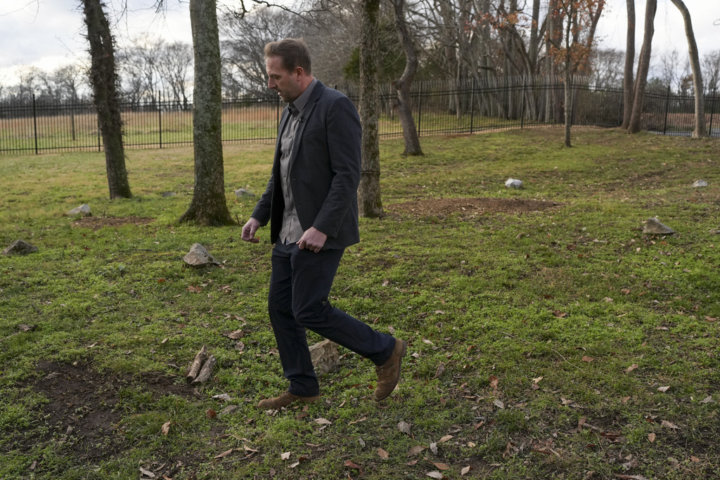 Archaeologist James Greene walks through a slave cemetery in Nashville, Tenn.
