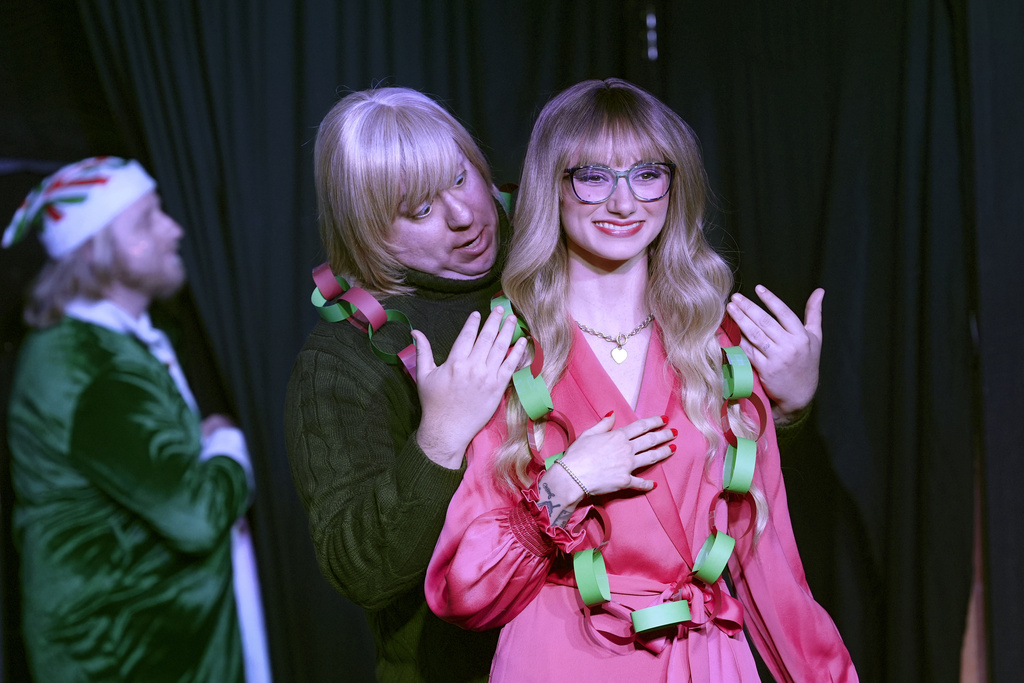 Michael Howell, center, and GinaKay Howell appear during a dress rehearsal for the production of "The Holiday Channel Christmas Movie Wonderthon"