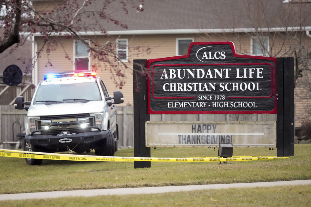 Emergency vehicles are parked outside the Abundant Life Christian School in Madison, Wis.
