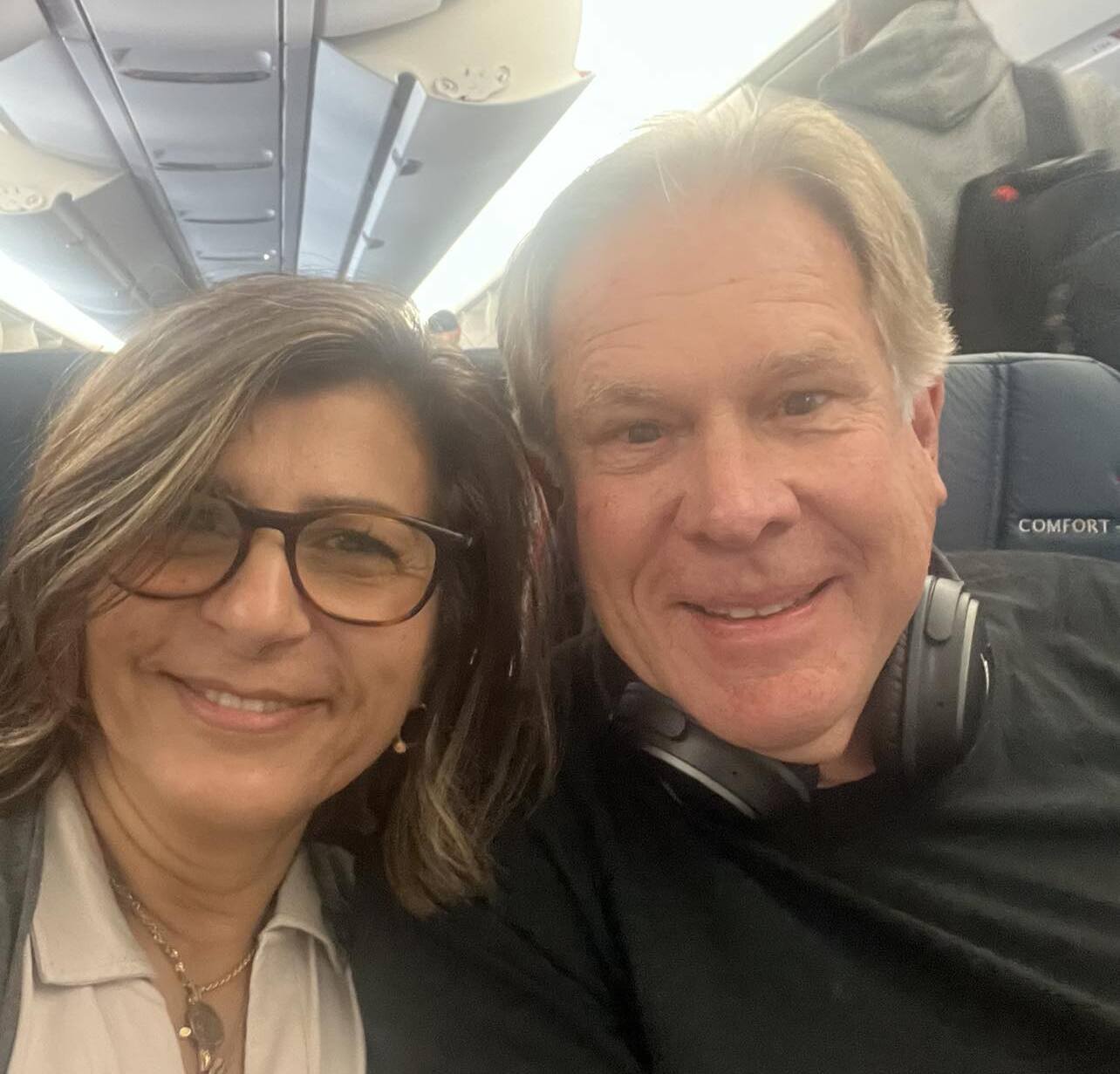 Lina and Alan on their flight in Atlanta heading to Tel Aviv.