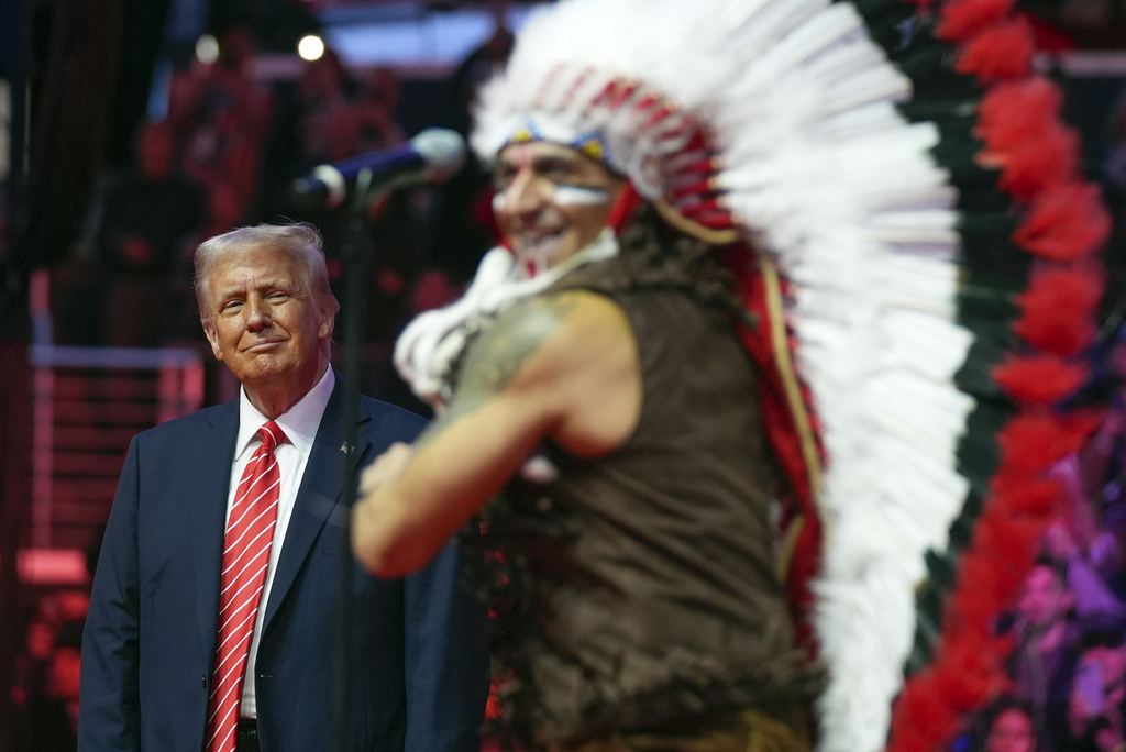 President-elect Donald Trump watches The Village People perform at a rally ahead of the 60th Presidential Inauguration