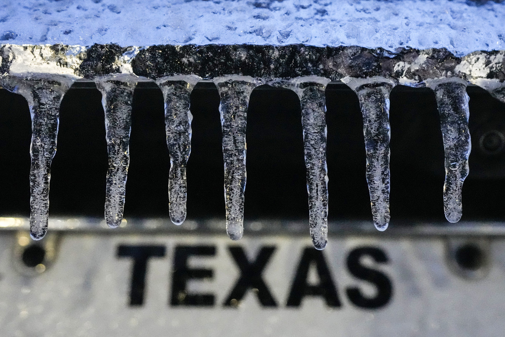 Icicles hang down from a vehicle during an icy winter storm in Galveston, Texas