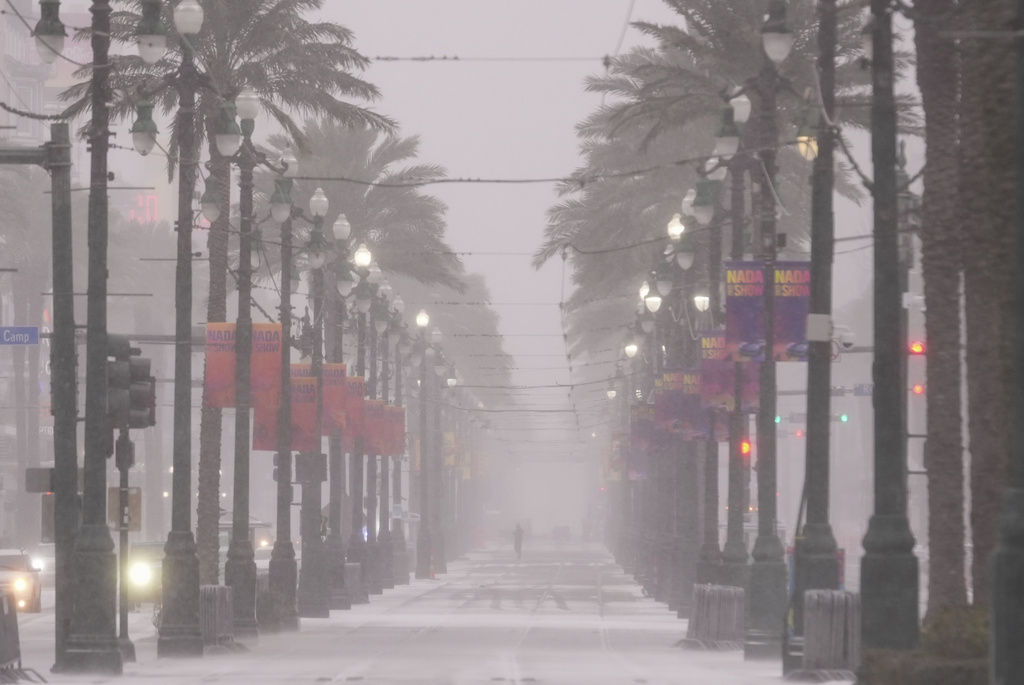 Snow covers Canal Street in downtown New Orleans