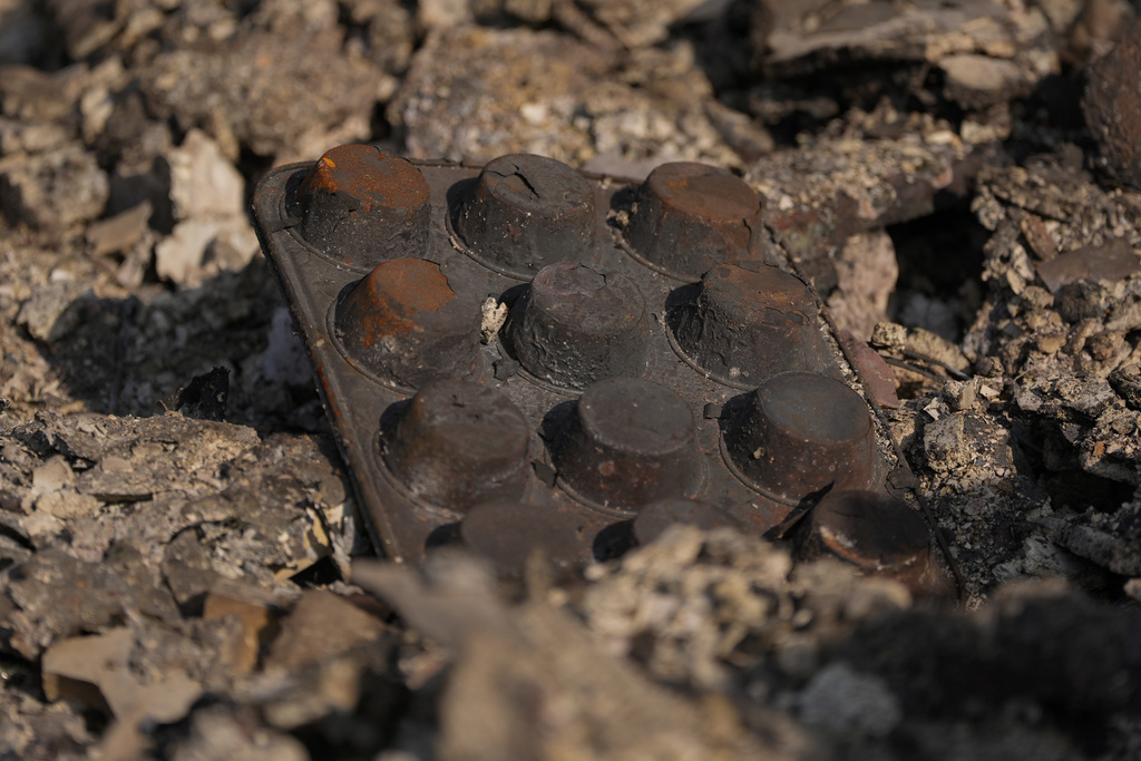 Charred muffin tins poke out of the rubble of what remains of Chef Daniel Shemtob