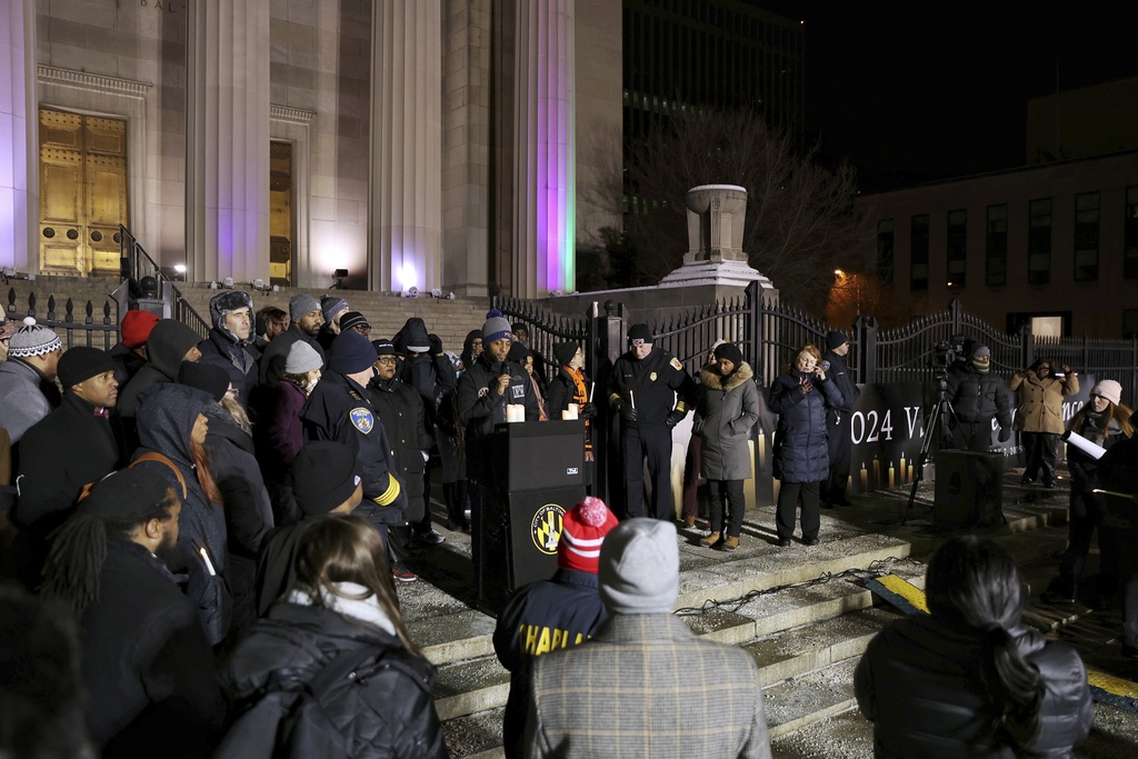 Baltimore Mayor Brandon Scott addresses attendees at the annual Vigil of Remembrance at War Memorial Plaza to honor the lives of Baltimoreans lost in 2024.