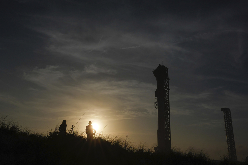 The sun sets behind SpaceX