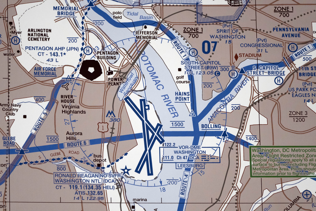 Chart showing Reagan National Airport and the surrounding area is displayed during a news conference at the National Transportation Safety Board 