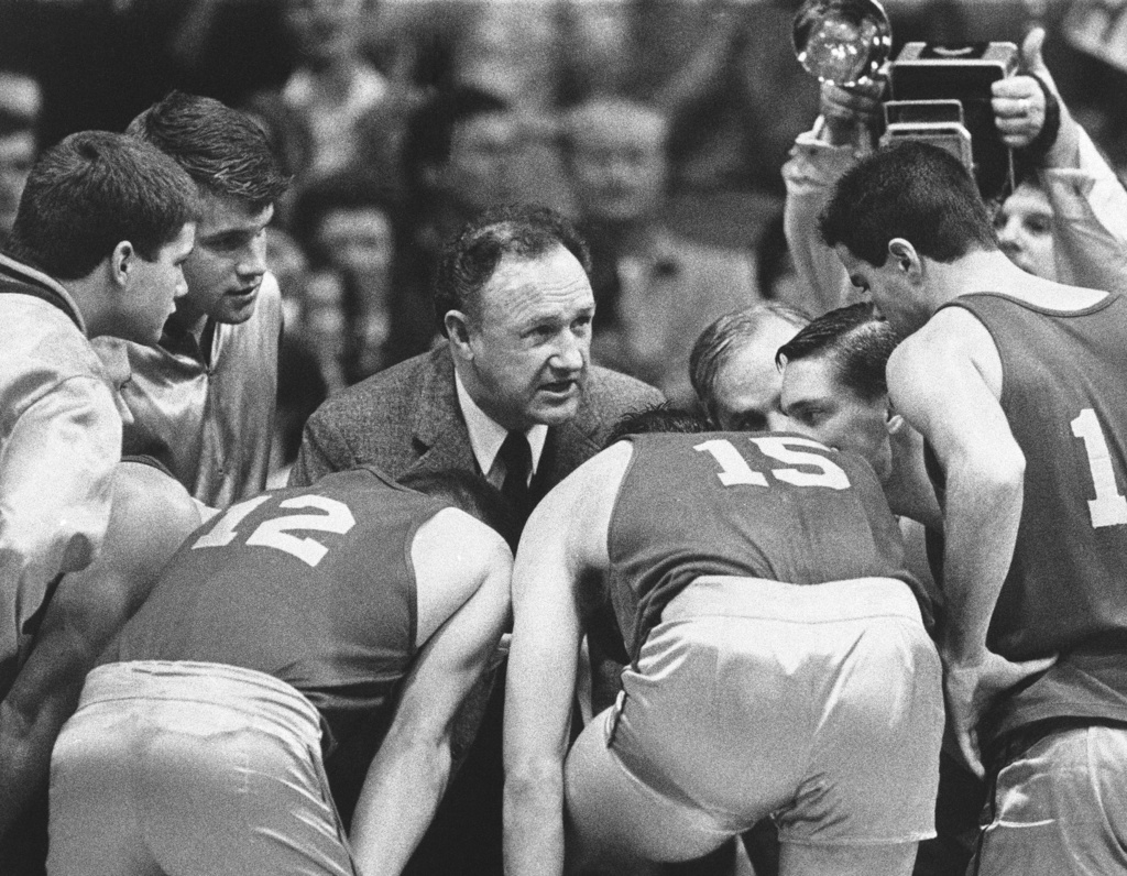 Actor Gene Hackman gives fictional Hickory High basketball players instructions during filming of the final game of the movie "Hoosiers" at Hinkle Fieldhouse on the Butler University campus, 1985, in Indianapolis.