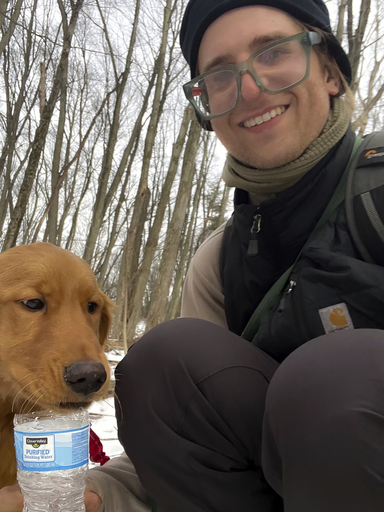 Collin Leiby, shown is Leibya moments after he found a missing six-month-old Golden pup named Freddy, a week after the dog ran off from his home at the base of Sharp Mountain in Pottsville, Pa.