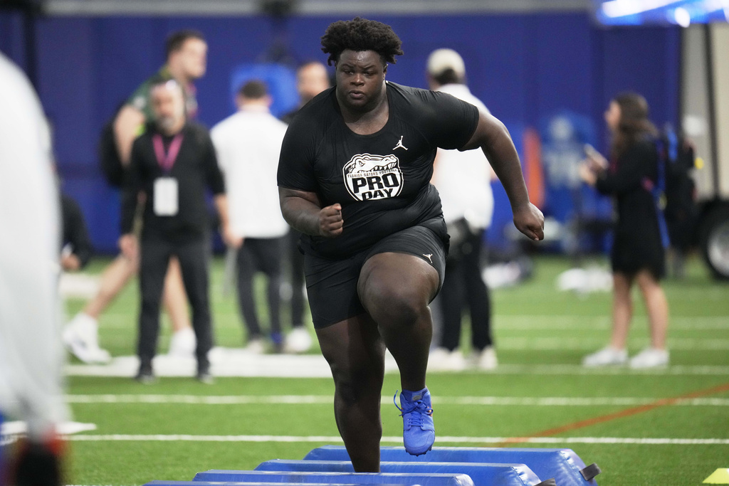 Desmond Watson runs through a drill during the school