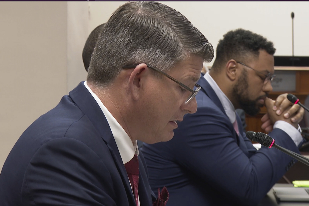 Bobby Gumpright speaks to lawmakers at a packed committee room at the state Capitol